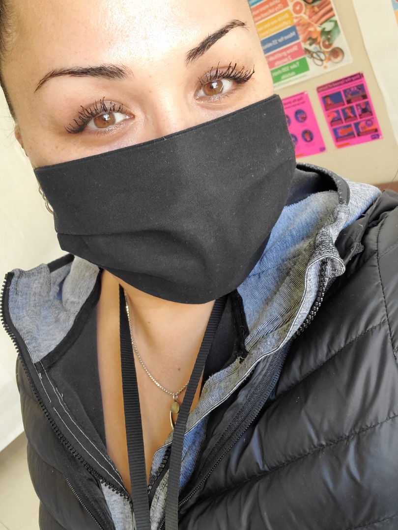 Ashley Yoro Flowers, HCA, demonstrates proper mask wearing